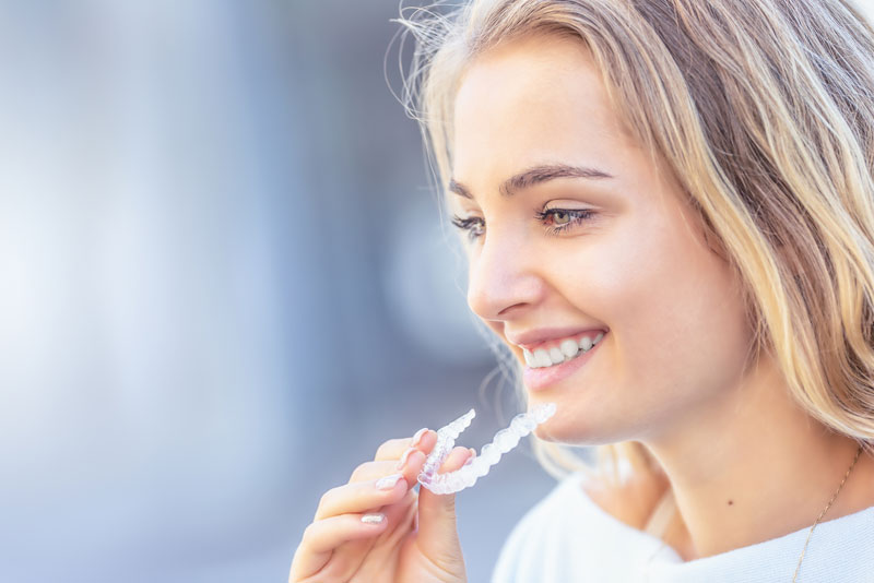 Dental Patient Using Invisalign Clear Aligners