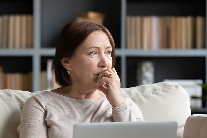 Dental Patient Wondering If She Should Get Dental Implants Or Dentures in Charlotte, NC