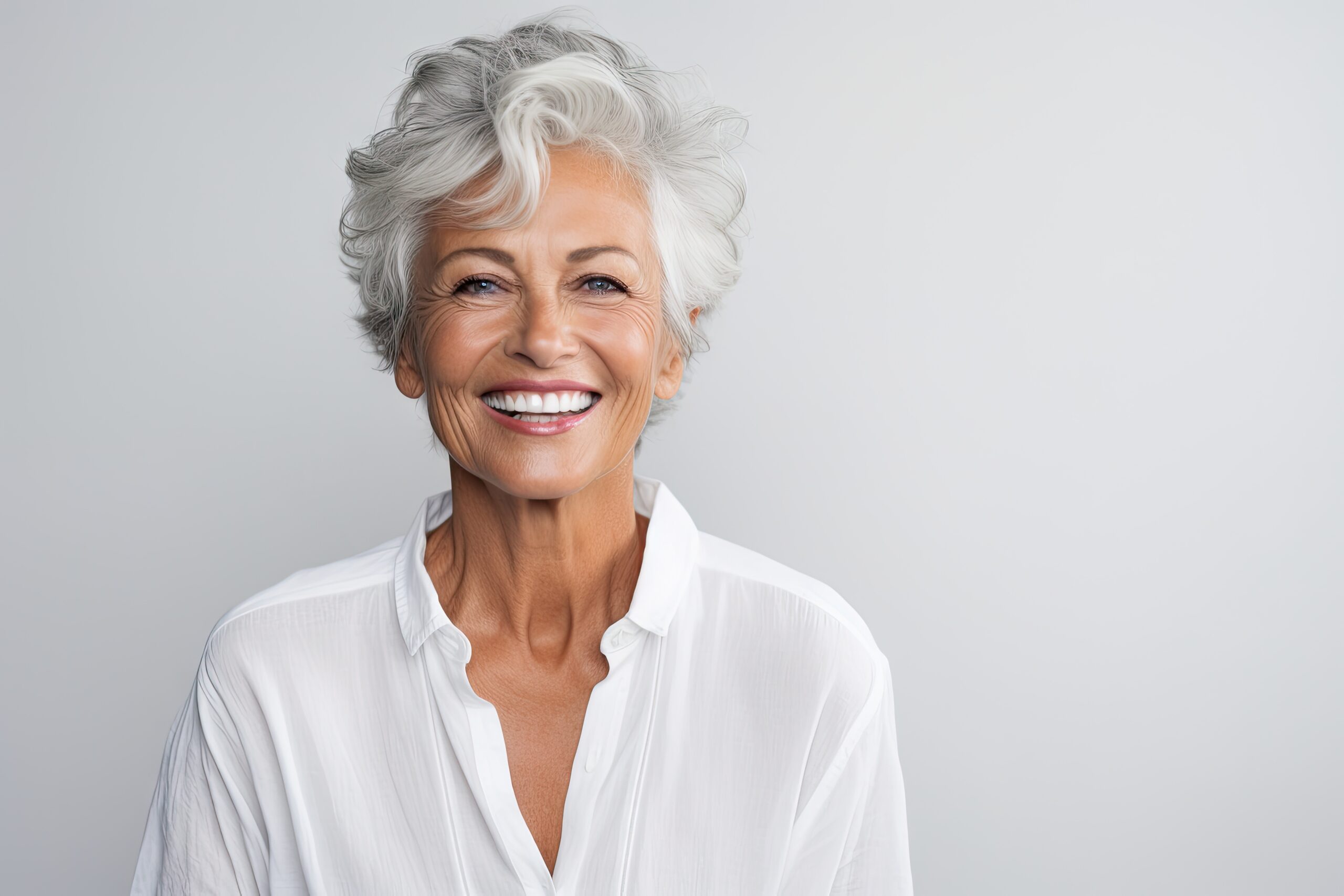 an image of a woman smiling with porcelain veneers.