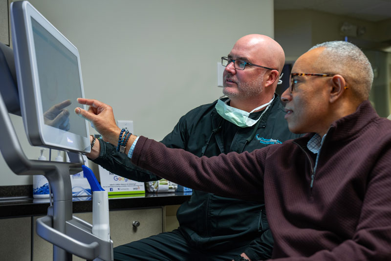 Dr. Ed Porter Showing Dental Patient X-Ray