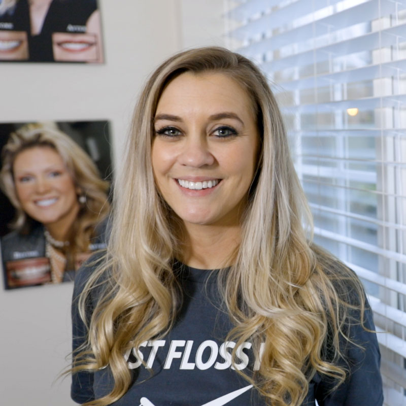 A close-up of Jenna, her newfound confidence illuminated by her vibrant, healthy smile post-Smile Makeover, reflecting her triumph over past dental struggles.