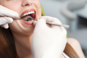 Dentist examining a patient during a comprehensive dental exam