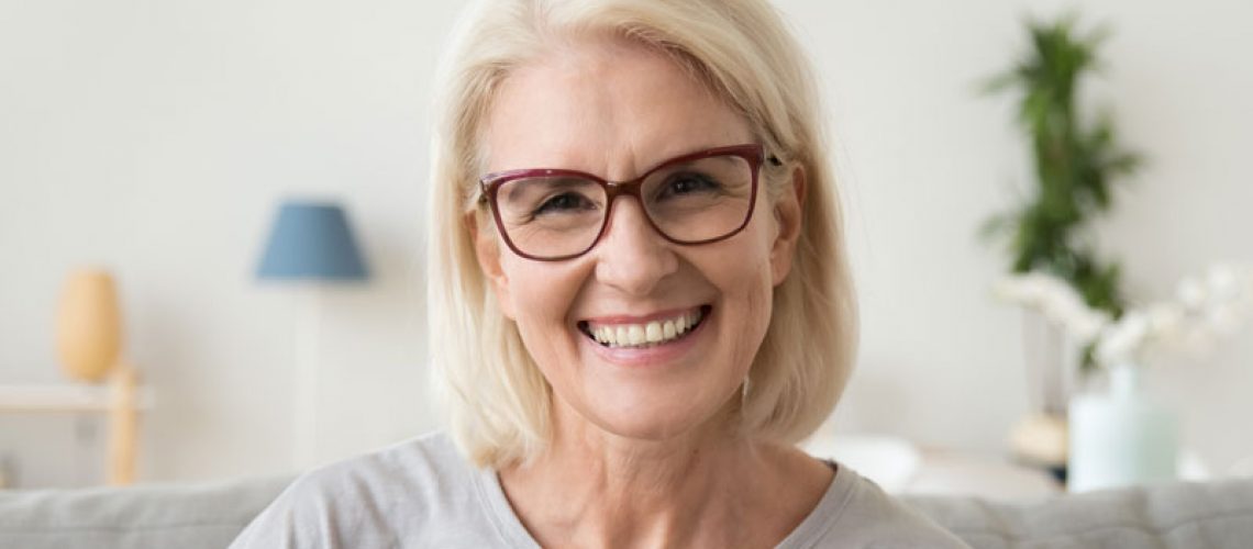 Dental Patient Smiling After Getting Dental Implants In Charlotte, NC