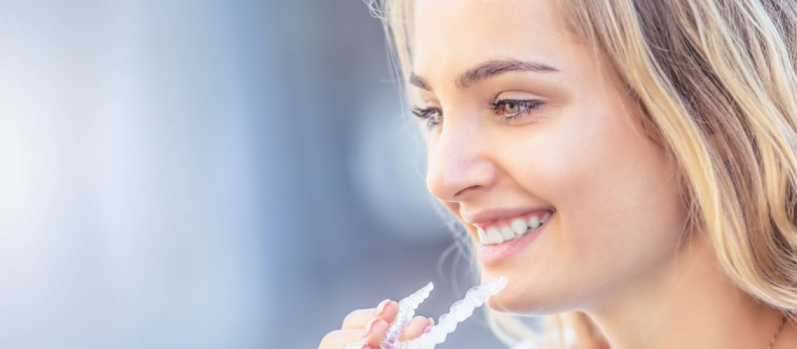 Dental Patient Using Invisalign Clear Aligners