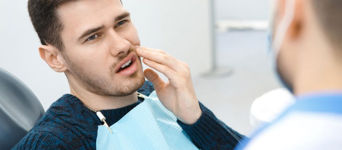 Dental Patient Suffering From Mouth Pain On A Dental Chair, In Charlotte, NC